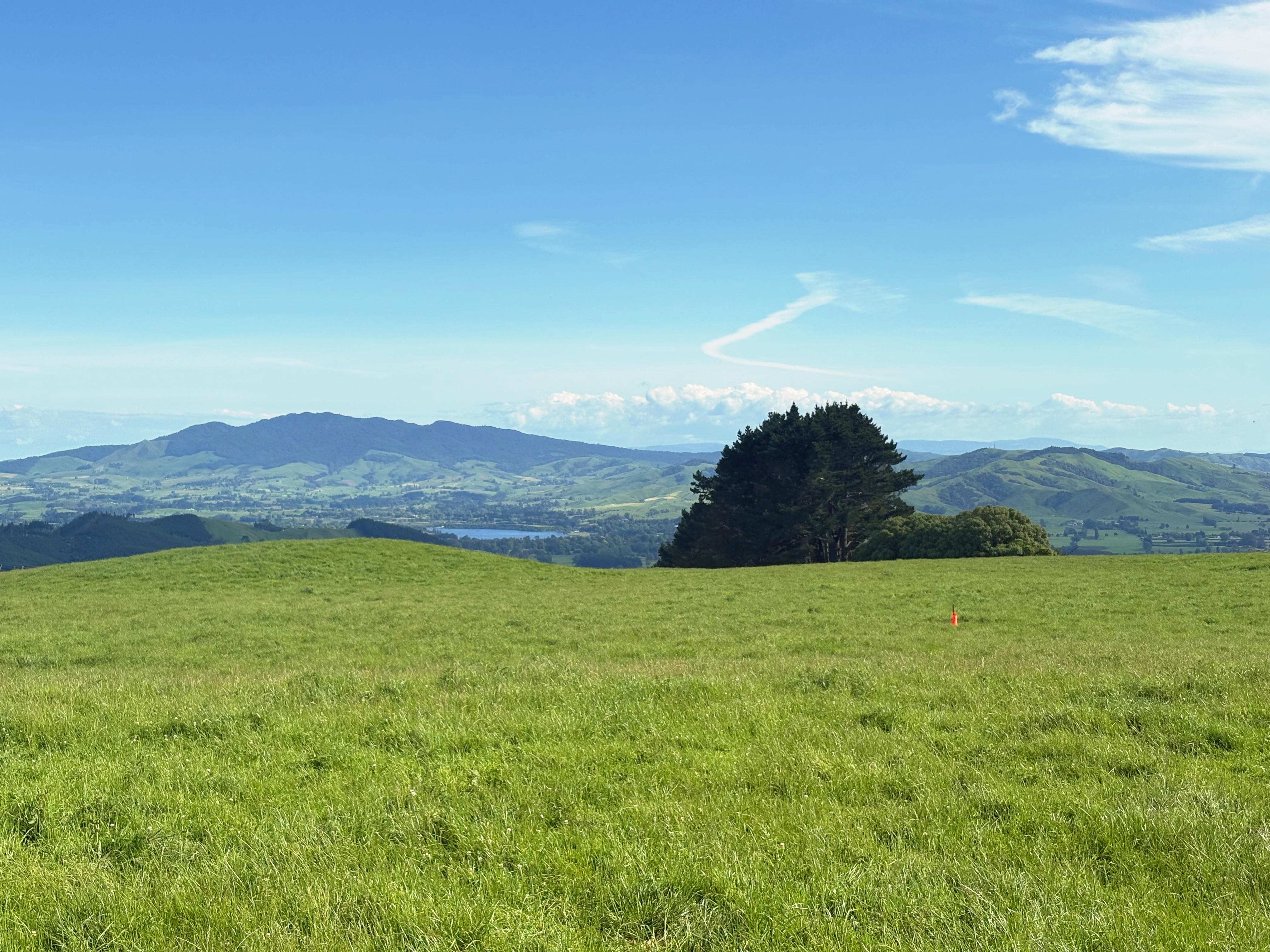 Distant lake nestles
in a green bowl with blue skies
and white clouds skirmish
